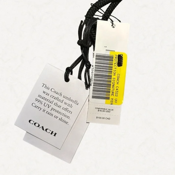 Coach UV Protection Signature Mini Umbrella, style number C4322.